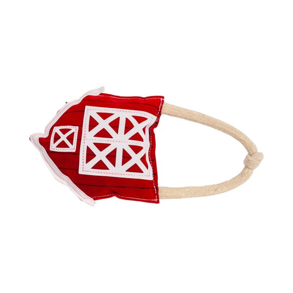 Durable vegan leather dog chew toy shaped like a red barn