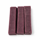 Handmade Himalayan yak cheese dog chews with natural blueberry flavor, made from yak milk, cow milk, lime juice, and salt, offering a firm, protein-rich, rawhide-free chew in 10-count packs available in Small, Medium, and Large.