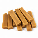 Handmade Himalayan yak cheese dog chews made with yak milk, cow milk, lime juice, and salt, offering a firm, protein-rich, rawhide-free chew in 10-count packs available in five sizes from Small to XXL.