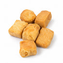 Pumpkin-flavored puffed yak cheese dog treats made with milk, lime juice, salt, and natural pumpkin flavor, packaged in a 1 lb bulk bag.